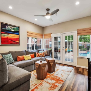 Resident lounge with flat screen looking out onto the pool