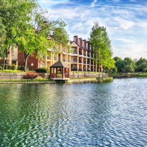 Serene view of waterfront gazebo and the lake against beautiful blue skies